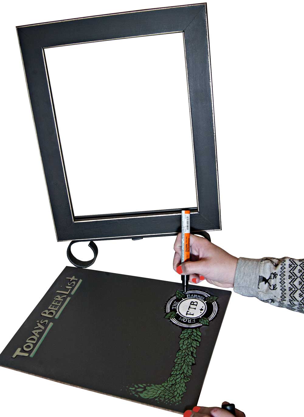 Drawing on a Cohas Chalkboard when out of the tabletop display stand An artist drawing on a Cohas Chalkboard when out of the tabletop display stand