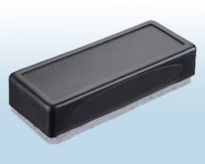 A simple dry ersase eraser in Black wih a gray felt base, used to remove Zig Posterman Wet-Wipe marks from a paint marker
