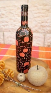 Black wine Bottle DIY with Zig Posterman Orange Paint Markers on a fall colored orange table cloth