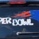 The Patriots logo drawn with Zig Posterman on the back window of car