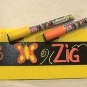 Two Zig Posterman markers shown with an example of how they can be used with tape