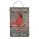 Personalized Winter Cardinal Welcome Slate Sign features a red cardinal perched on a winter branch, with "Welcome" and "Your Text" written out in white font.